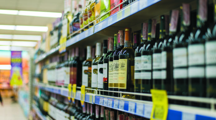 Kiev, Ukraine - January 3, 2019: Shelves with alcoholic drinks in the supermarket.